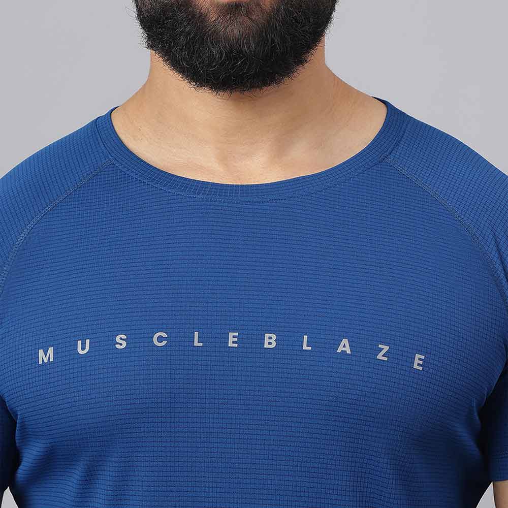 7 - MuscleBlaze Patterned Dry-Fit Active Tee Half Sleeve,  Poseidon  Small